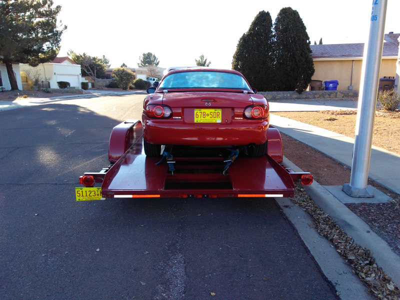 Illustration for article titled A frosty Miata upon its sleigh awaits the journey home.